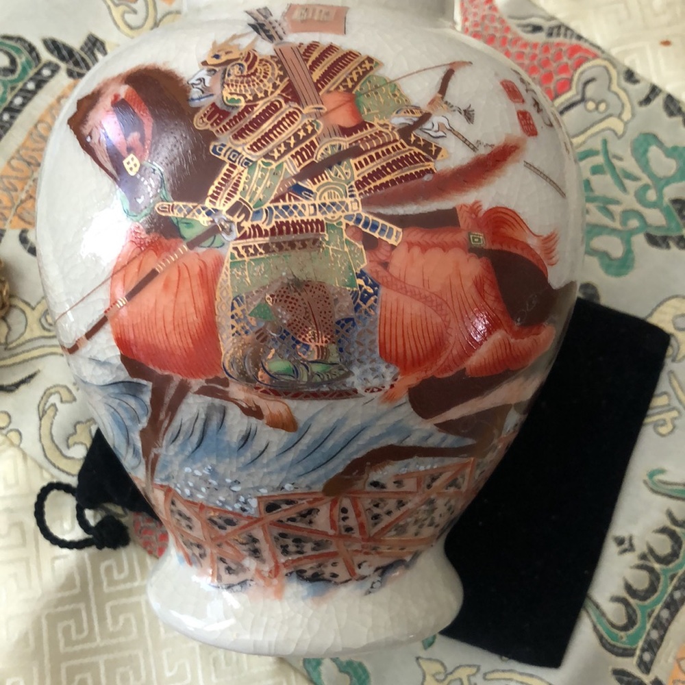 Japanese ceramic vase . Samurai on horseback.